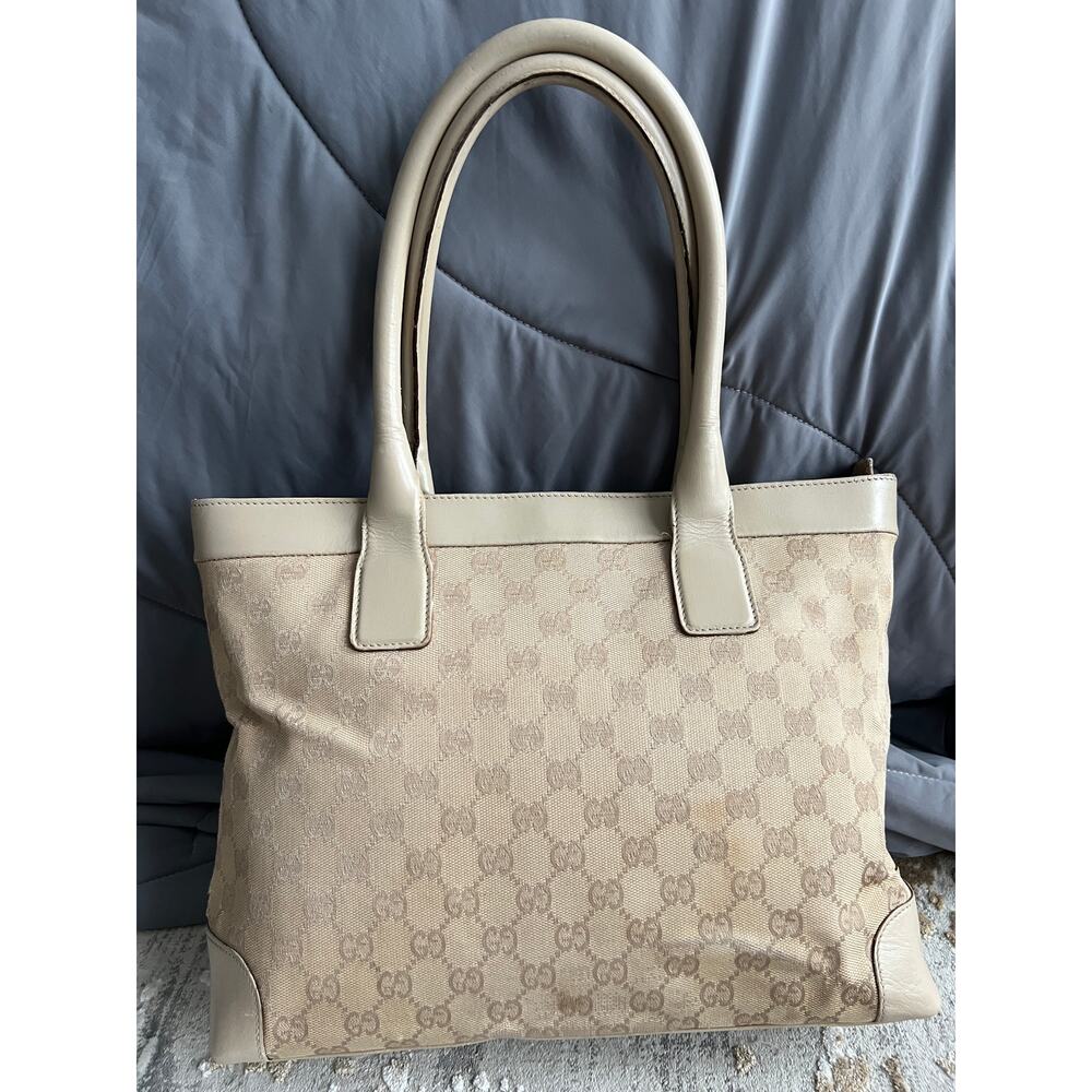 Gucci tote bag canvas with leather trim and leather handles.